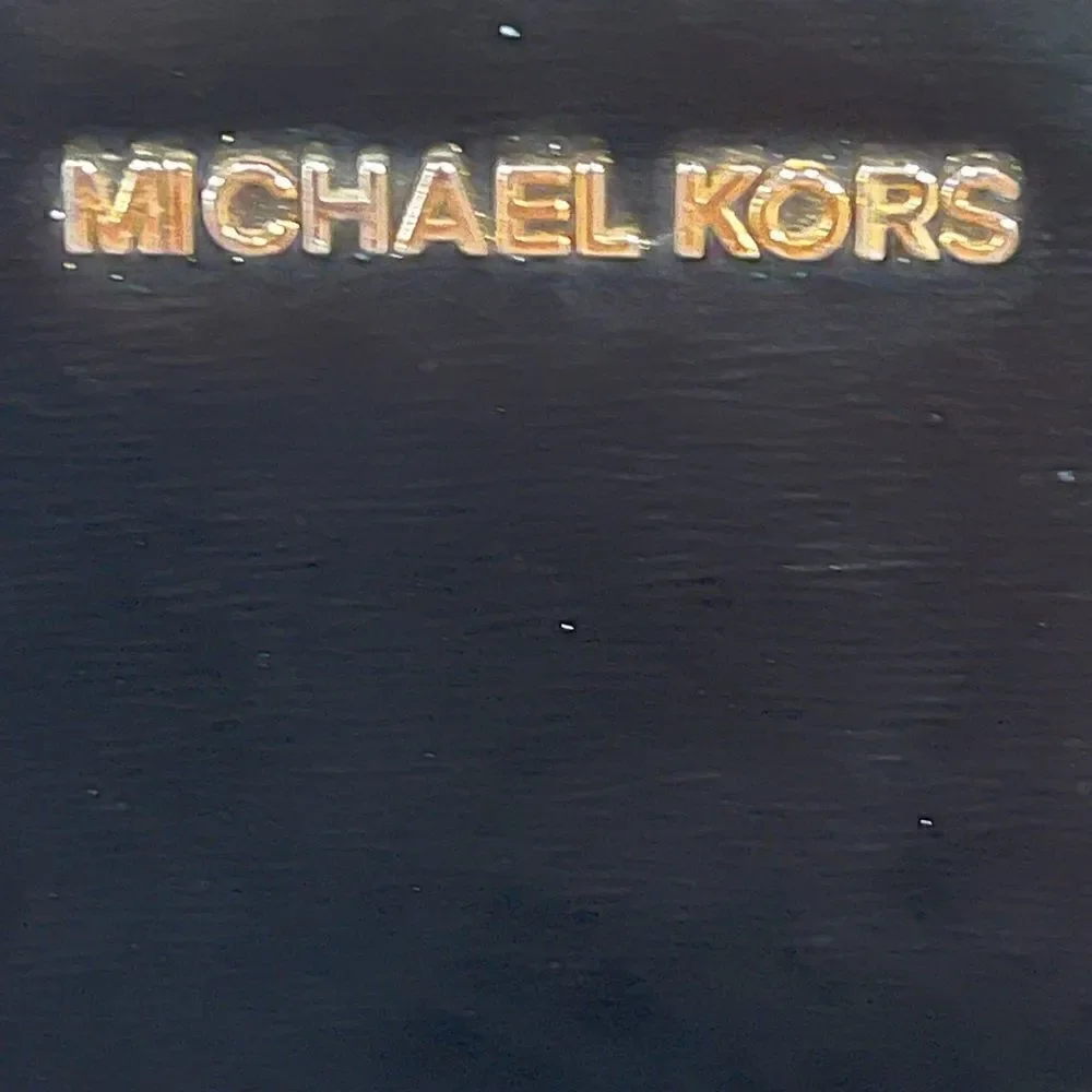 Coach-Michael Kors-Nine West Three Branded Wristlets